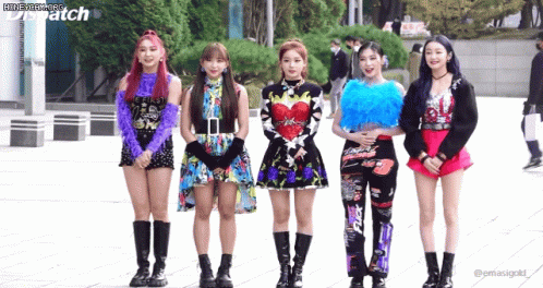 A Group Of Girls Are Standing Next To Each Other In Front Of A Building With Dispatch Written On The Bottom GIF