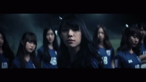 A Group Of Girls Wearing Blue Jerseys With The Number 48 GIF