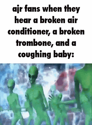A Group Of Green Aliens Are Standing Next To Each Other In A Room . GIF