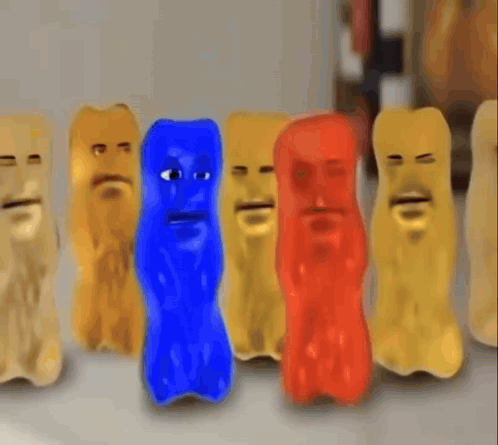 A Group Of Gummy Bears With Faces Are Lined Up In A Row GIF