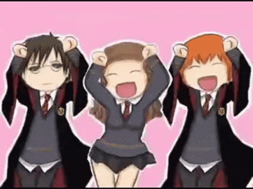 a group of harry potter characters are standing next to each other with their hands in the air .