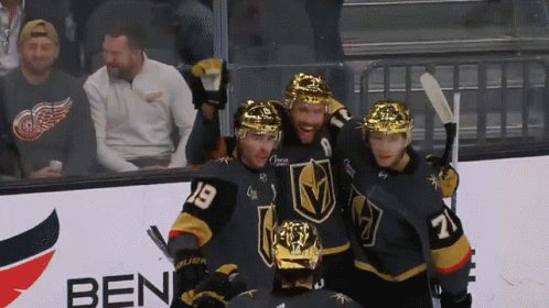 A Group Of Hockey Players Are Posing For A Photo In Front Of A Ben Sign GIF