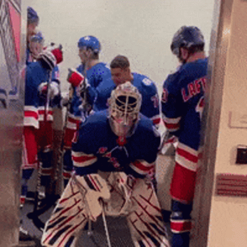 A Group Of Hockey Players One Of Whom Is Wearing A Jersey That Says Laft GIF
