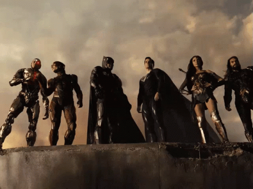 A Group Of Justice League Characters Are Standing Together GIF