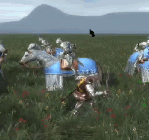 A Group Of Knights Are Riding Horses In A Field With Mountains In The Background . GIF