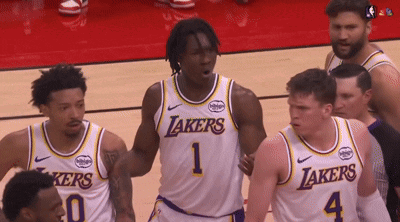 a group of lakers basketball players are on the court