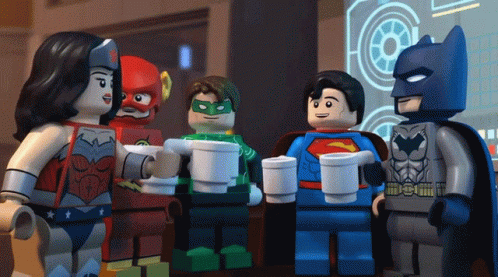 A Group Of Lego Superheroes Standing Around Drinking Coffee GIF