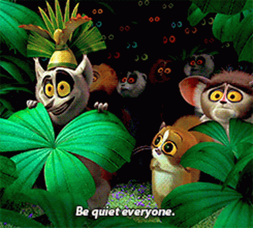 A Group Of Lemurs Are Standing In A Jungle With The Words Be Quiet Everyone Written Below Them GIF