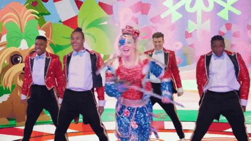 A Group Of Men And A Woman Are Dancing In Front Of A Colorful Background GIF