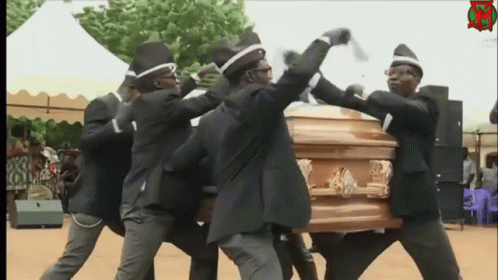 A Group Of Men Are Carrying A Coffin While Wearing Black Suits And Hats GIF