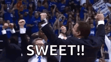A Group Of Men Are Celebrating A Basketball Game With Their Fists In The Air And The Words `` Sweet ! '' GIF