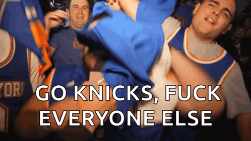 A Group Of Men Are Cheering For The New York Knicks Basketball Team GIF