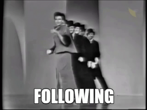 A Group Of Men Are Dancing In A Black And White Photo With The Word Following Above Them GIF