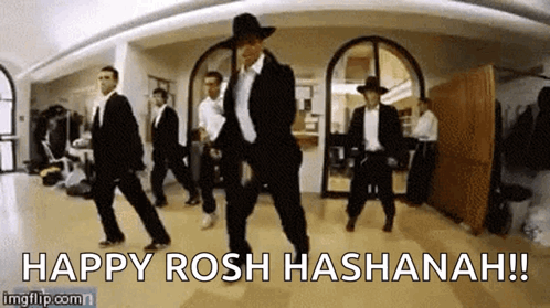 A Group Of Men Are Dancing In A Room With The Words Happy Rosh Hashanah ! GIF