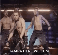 A Group Of Men Are Dancing On A Stage In A Club . GIF