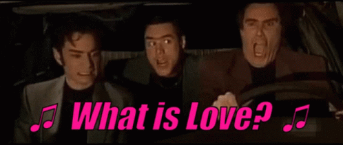 a group of men are driving a car and singing a song .