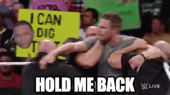 A Group Of Men Are Hugging Each Other In Front Of A Sign That Says " I Can Dig It " . GIF