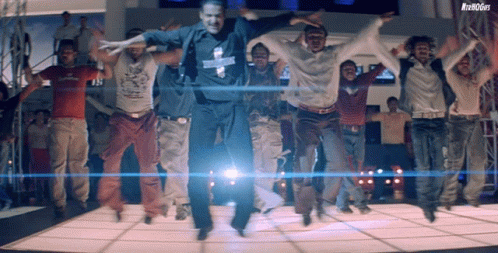 a group of men are jumping in the air while wearing a shirt that says ' denim guys ' on it