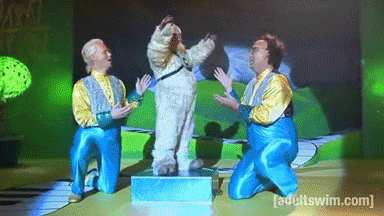 A Group Of Men Are Kneeling In Front Of A Screen That Says [ Adult Swim ] GIF
