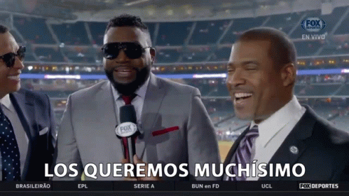 a group of men are laughing with the words los queremos muchisimo on the bottom