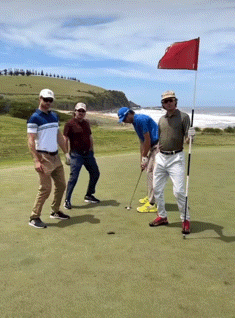A Group Of Men Are Playing Golf On A Golf Course GIF
