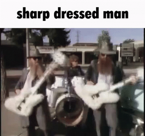 A Group Of Men Are Playing Guitars In A Band . GIF