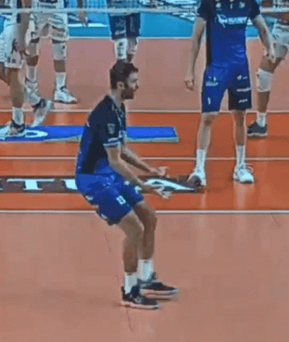 A Group Of Men Are Playing Volleyball On A Court And One Of Them Is Wearing A Number 11 Jersey . GIF