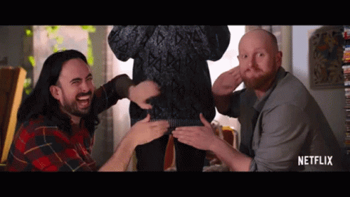 Men Playing With Woman's Sweater In Netflix Ad GIF