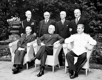 A Group Of Men Are Posing For A Picture While Sitting In Chairs GIF