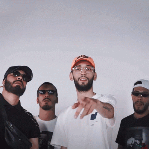 A Group Of Men Are Posing For A Picture With One Wearing A Hat That Says Nike GIF