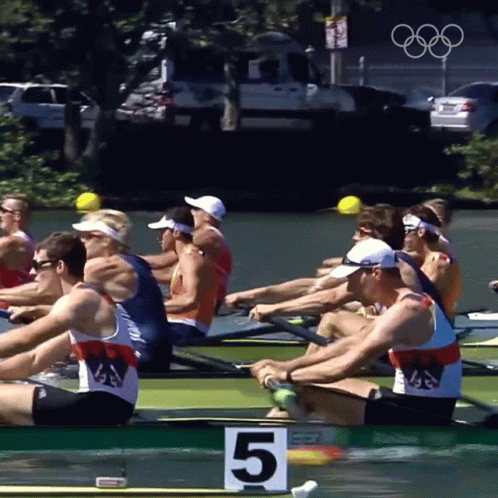 A Group Of Men Are Rowing A Boat With The Number 5 On The Front GIF