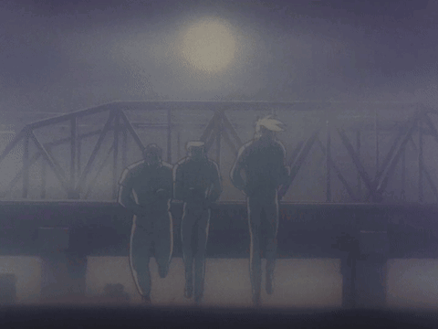 A Group Of Men Are Running Across A Bridge In The Dark GIF