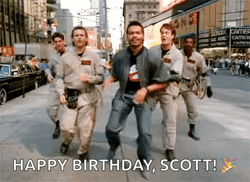 A Group Of Men Are Running Down A Street With The Words Happy Birthday Scott Written Below Them GIF
