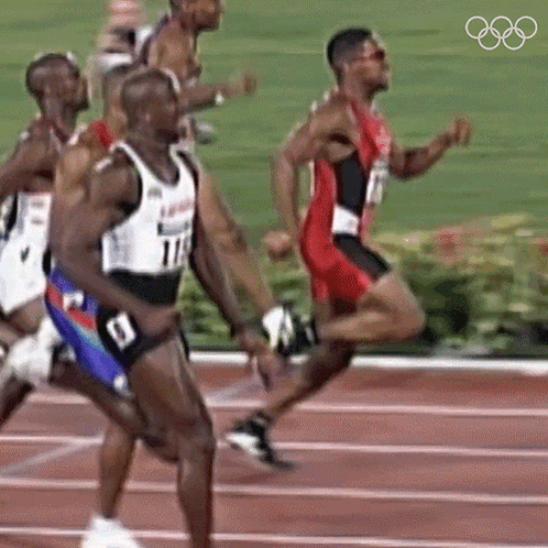 A Group Of Men Are Running On A Track And One Of Them Is Wearing Number 114 GIF