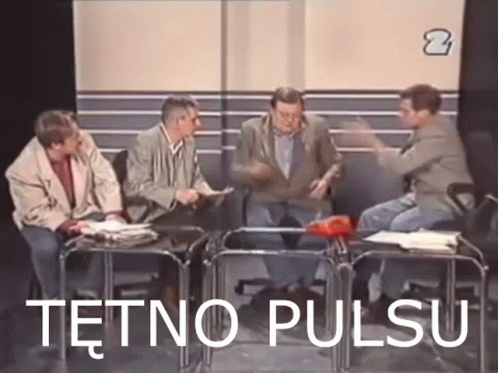 A Group Of Men Are Sitting Around A Table With The Words Tetno Pulsu Written On The Screen . GIF
