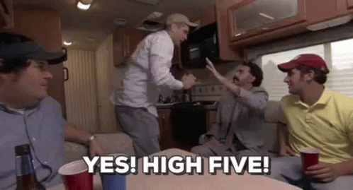 A Group Of Men Are Sitting In A Camper Van And One Of Them Is Giving A High Five . GIF