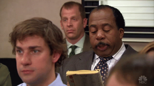 A Group Of Men Are Sitting In A Room With A Nbc Logo On The Bottom Right GIF