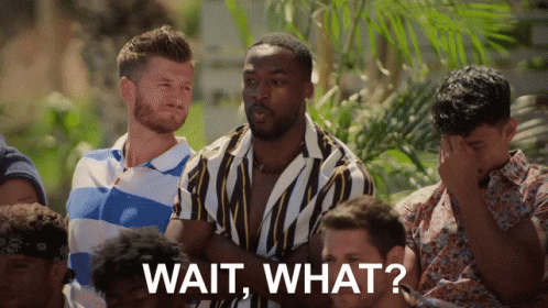 A Group Of Men Are Sitting In A Row And One Of Them Is Asking " Wait What " GIF