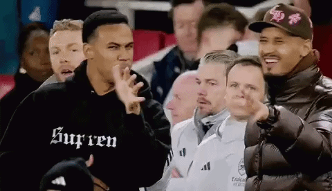 A Group Of Men Are Sitting In A Stadium Watching A Soccer Game And Making Funny Faces . GIF