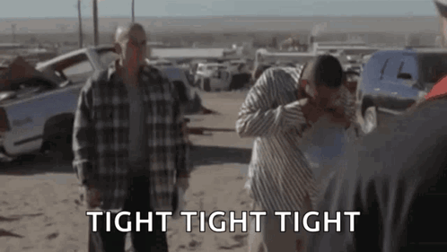 A Group Of Men Are Standing In A Field With The Words `` Tight Tight Tight '' In The Foreground . GIF