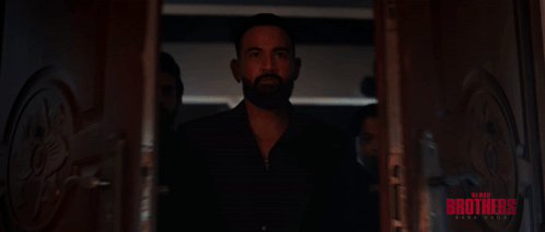 A Group Of Men Are Standing In A Hallway With The Word Brothers Written On The Bottom GIF