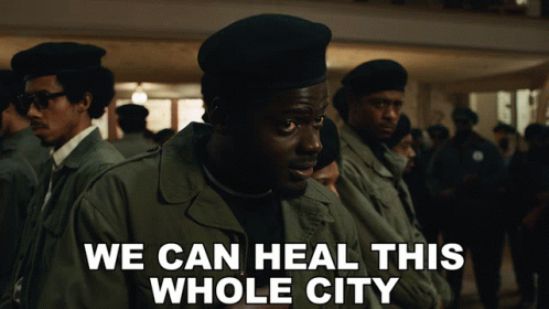 a group of men are standing in a line with the words we can heal this whole city on the bottom