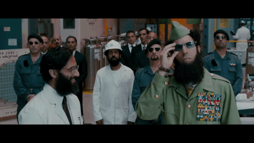 Group Of Men Standing With No Care Sign GIF