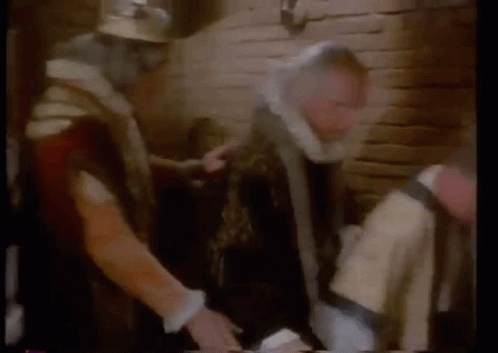 A Group Of Men Are Standing In A Room With Smoke Coming Out Of The Ceiling . GIF