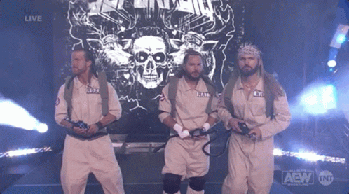 A Group Of Men Are Standing In Front Of A Screen That Says Live GIF