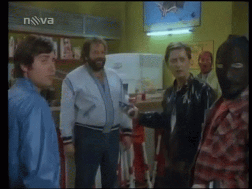 A Group Of Men Are Standing In Front Of A Tv Screen That Says Nova On It GIF