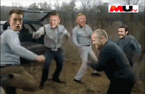 A Group Of Men Are Standing In The Dirt With Mu Written On The Bottom GIF