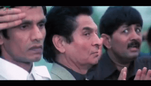 A Group Of Men Are Standing Next To Each Other And One Is Saluting GIF