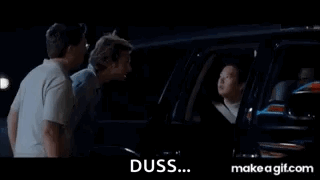 A Group Of Men Are Standing Next To Each Other In A Car At Night . GIF