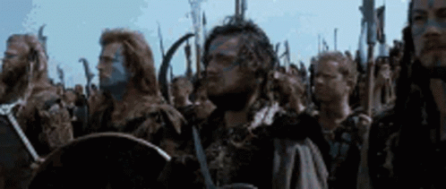 Men Standing In Line With Swords And Shields GIF